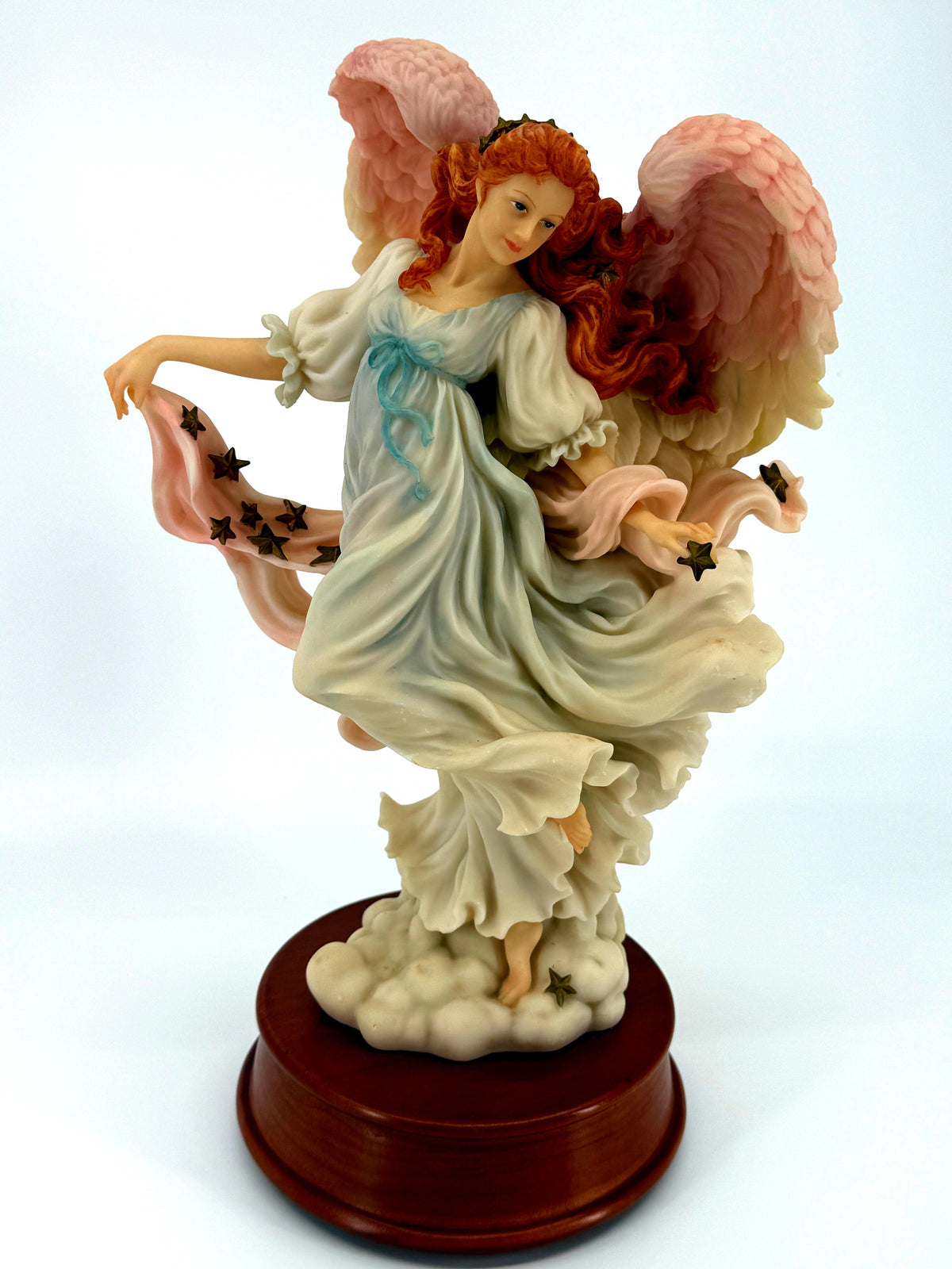 1997 Seraphim Classics Ariel Heaven's Shining Star musical angel figurine — front view on the round wood music base
