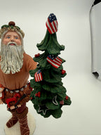 Vintage 1983 Duncan Royale Pioneer Santa figurine – close view of Santa's face and the flag-decorated Christmas tree
