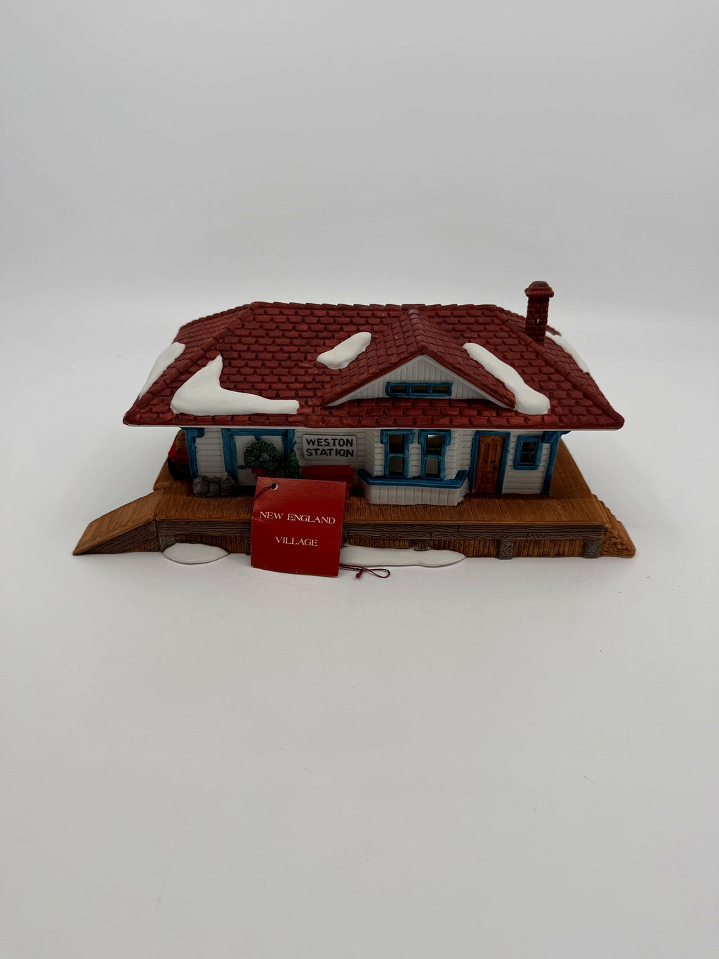 Department 56 New England Village Weston Train Station #5931-5 — front view with the original red New England Village hangtag and light cord