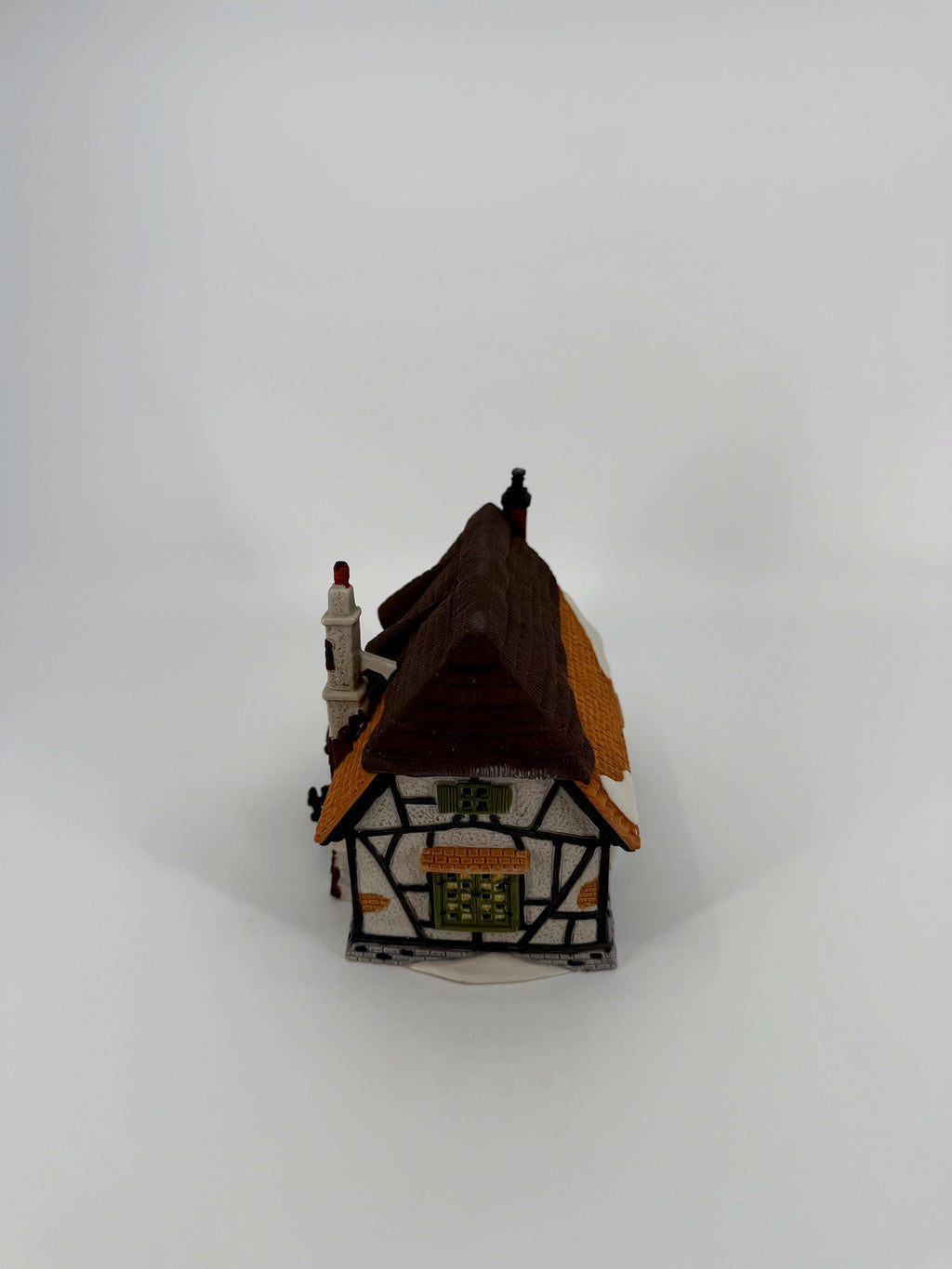 Department 56 Dickens' Village Maylie Cottage #5553-0, Oliver Twist — gable end with half-timbered walls and green windows