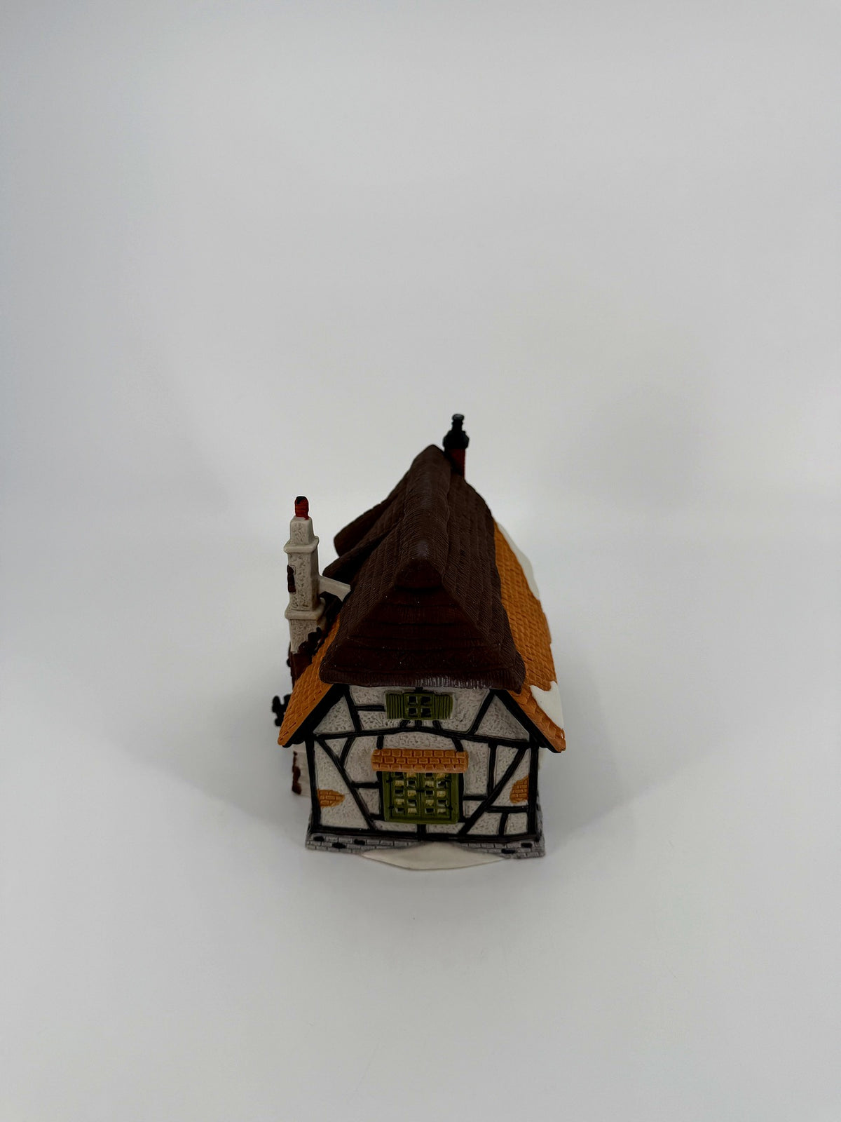 Department 56 Dickens' Village Maylie Cottage #5553-0, Oliver Twist — gable end with half-timbered walls and green windows