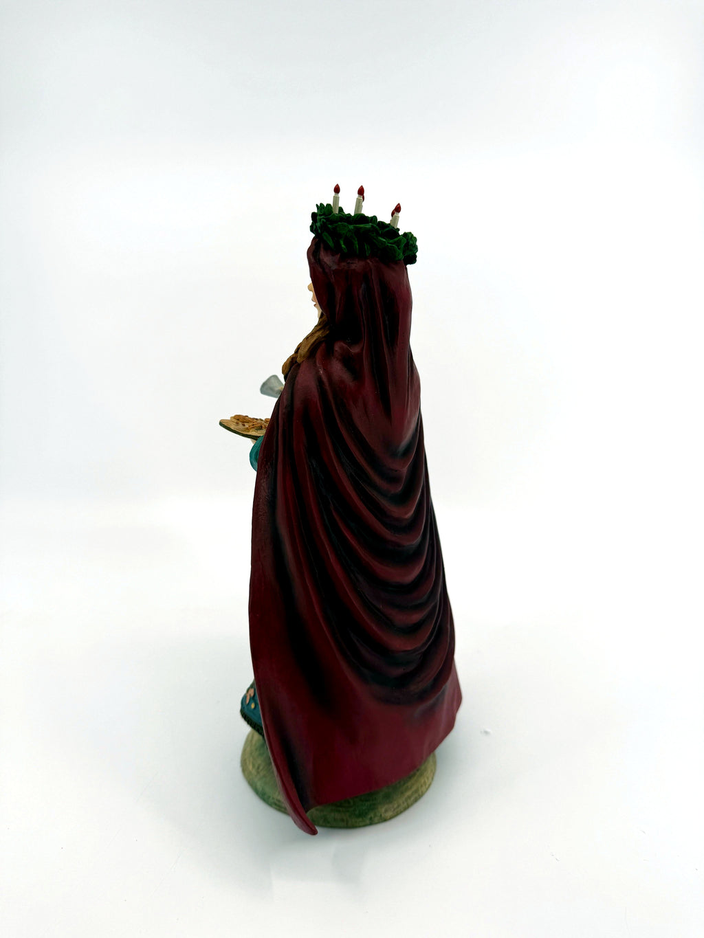 Back three-quarter view — burgundy cloak and candle crown