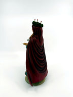 Back three-quarter view — burgundy cloak and candle crown