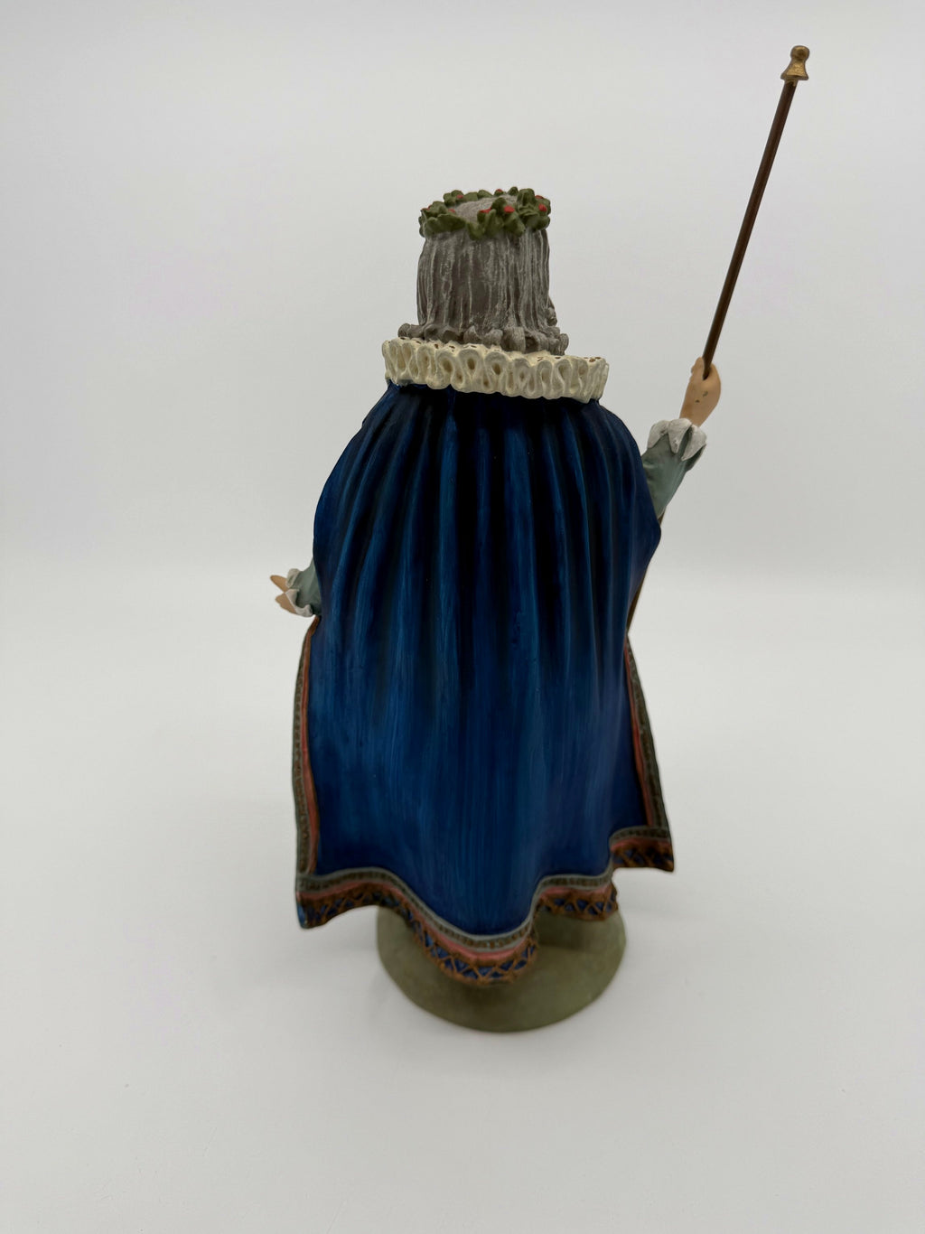 Vintage 1985 Duncan Royale Sir Christmas figurine – back view with staff: full sweep of the royal blue cape with pink-edged scalloped hem
