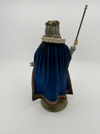 Vintage 1985 Duncan Royale Sir Christmas figurine – back view with staff: full sweep of the royal blue cape with pink-edged scalloped hem