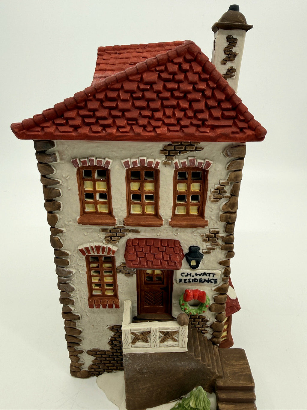 Department 56 Dickens' Village C. H. Watt Physician #5568-9 — front view: stone facade, C.H. Watt Residence sign, wreath, tall chimney