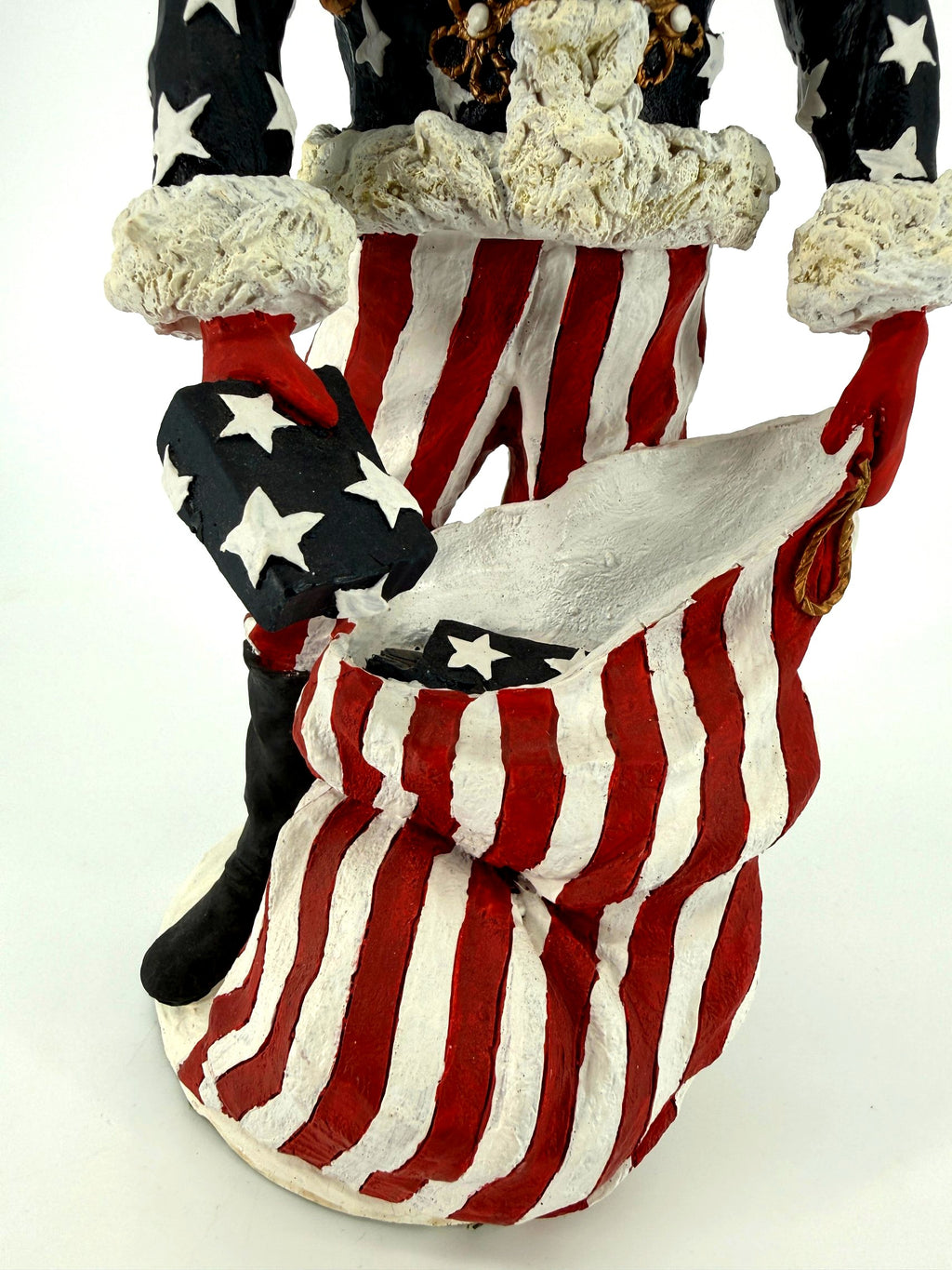 Duncan Royale Civil War Santa - lower detail of the striped trousers, black boot and the oversized stars-and-stripes toy sack