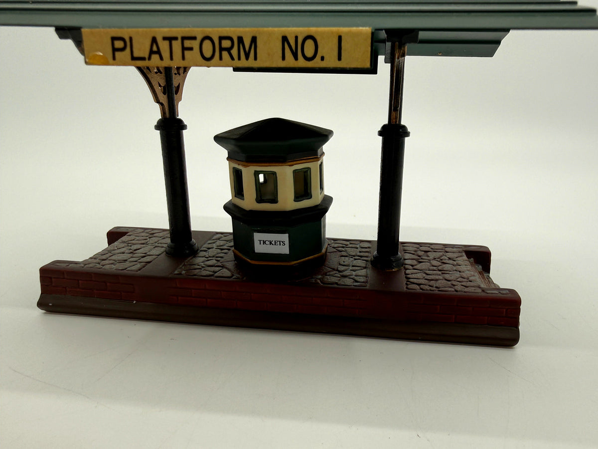 Close view: Platform No. 1 sign, decorative brackets and the ticket booth (enhanced photo)