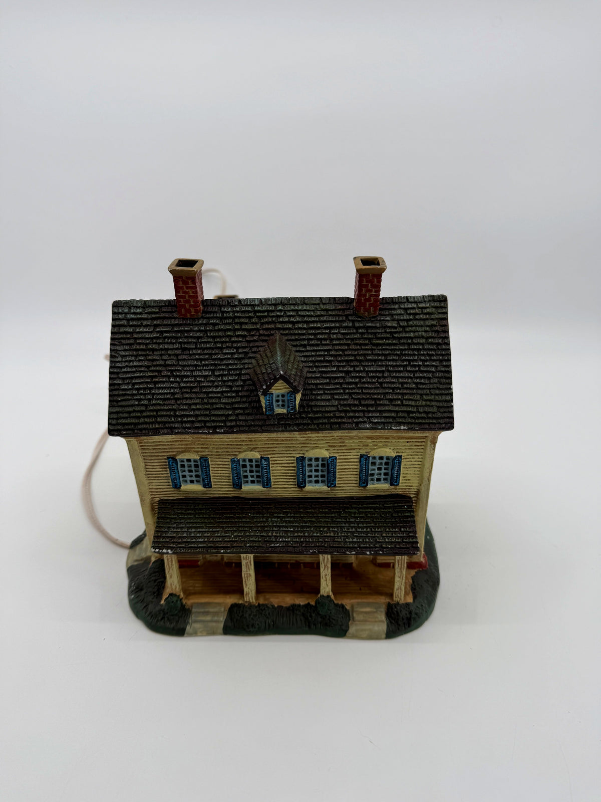 Front elevation and roof from above, showing the dormer window and shingled roof