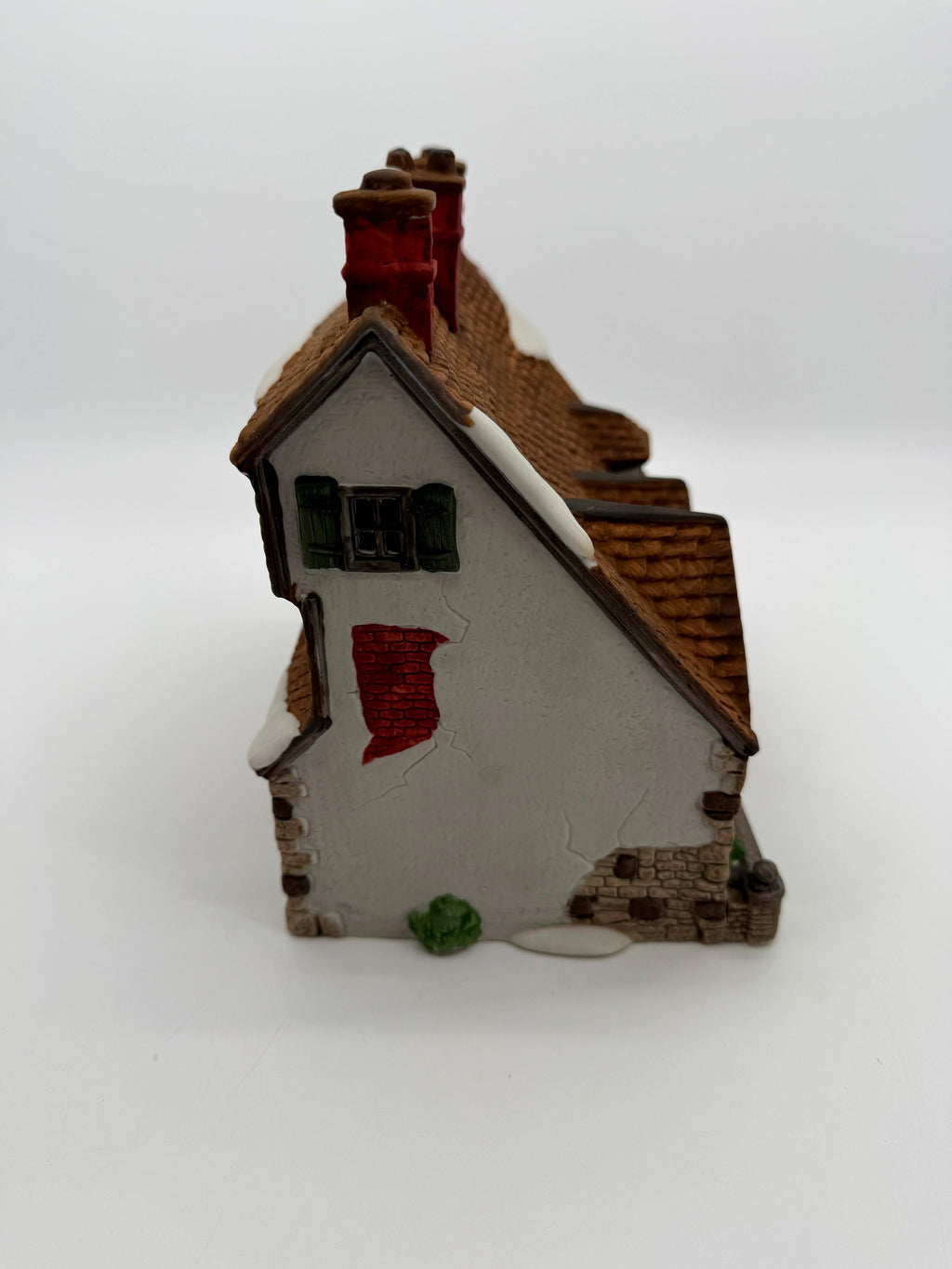 Right side - gable end with exposed brick detail