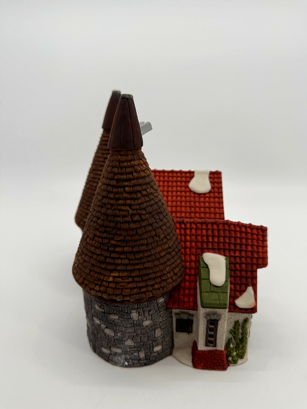 Side view showing the side door, red tile roofs and kiln cones