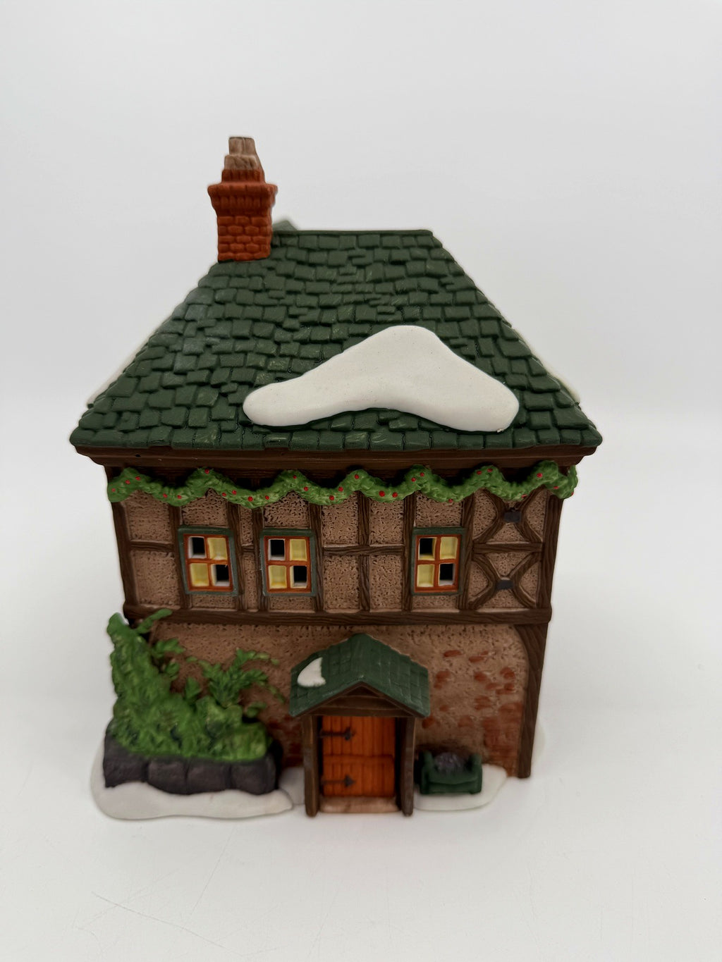 Department 56 Dickens' Village T. Puddlewick Spectacle Shop #58334 — side view with the door, green awning, and ivy planter