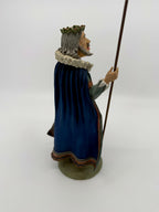 Vintage 1985 Duncan Royale Sir Christmas figurine – side profile view with staff: silver-gray hair, curled mustache and pointed beard, holly wreath