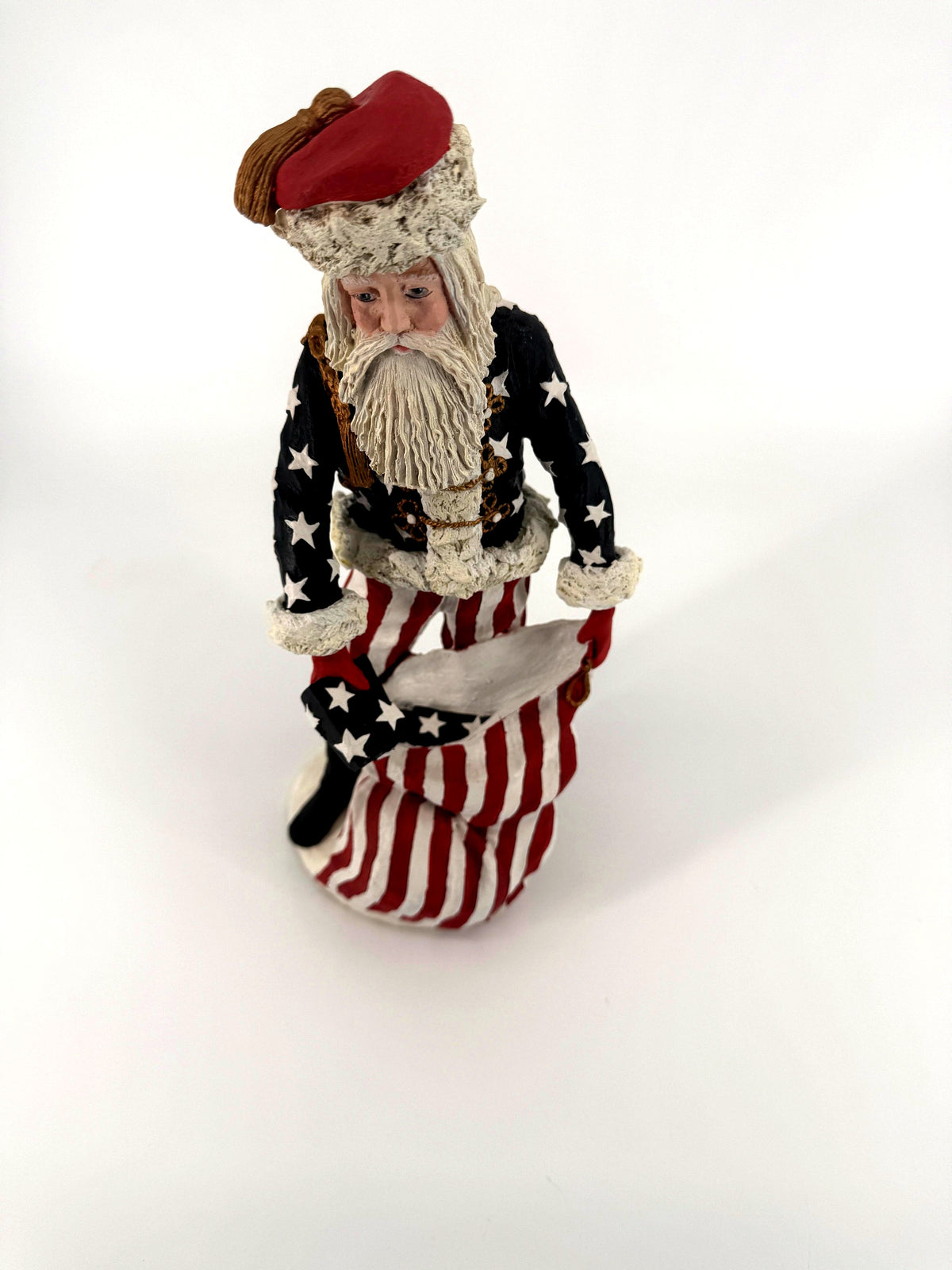 Duncan Royale Civil War Santa - high-angle three-quarter front view showing the red cap, white beard, star-covered coat and the open toy sack