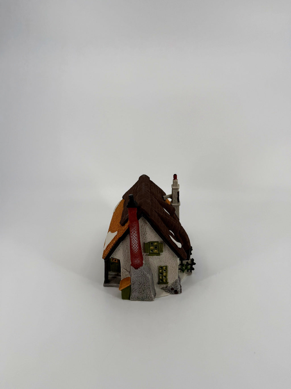 Department 56 Dickens' Village Maylie Cottage #5553-0, Oliver Twist — end view with the red brick chimney