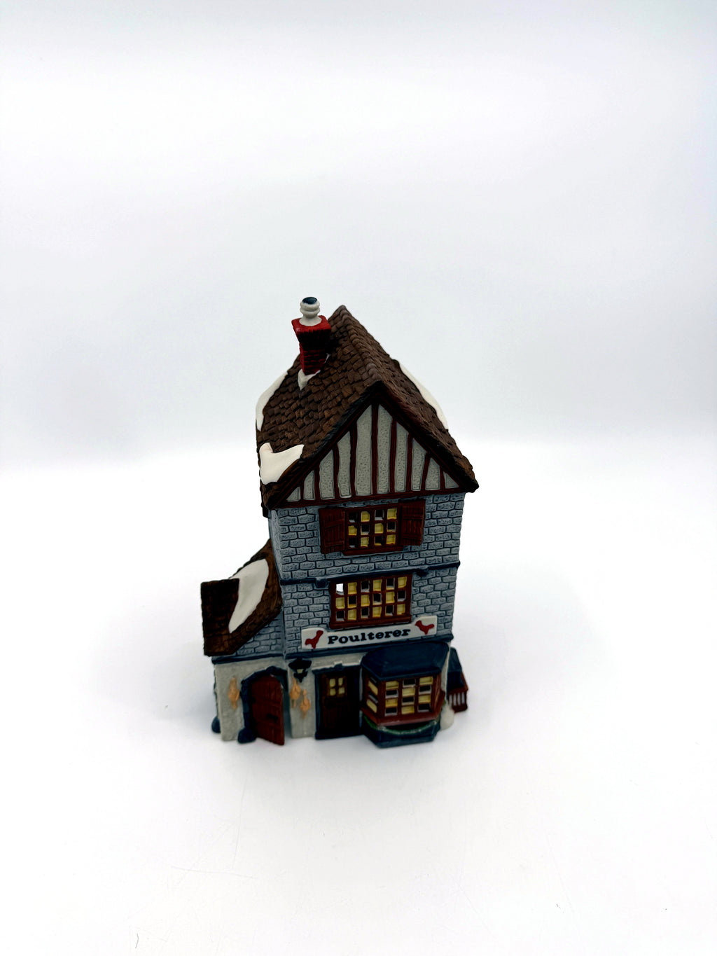 Department 56 Dickens' Village Poulterer 1988 lighted porcelain poultry shop — front three-quarter view