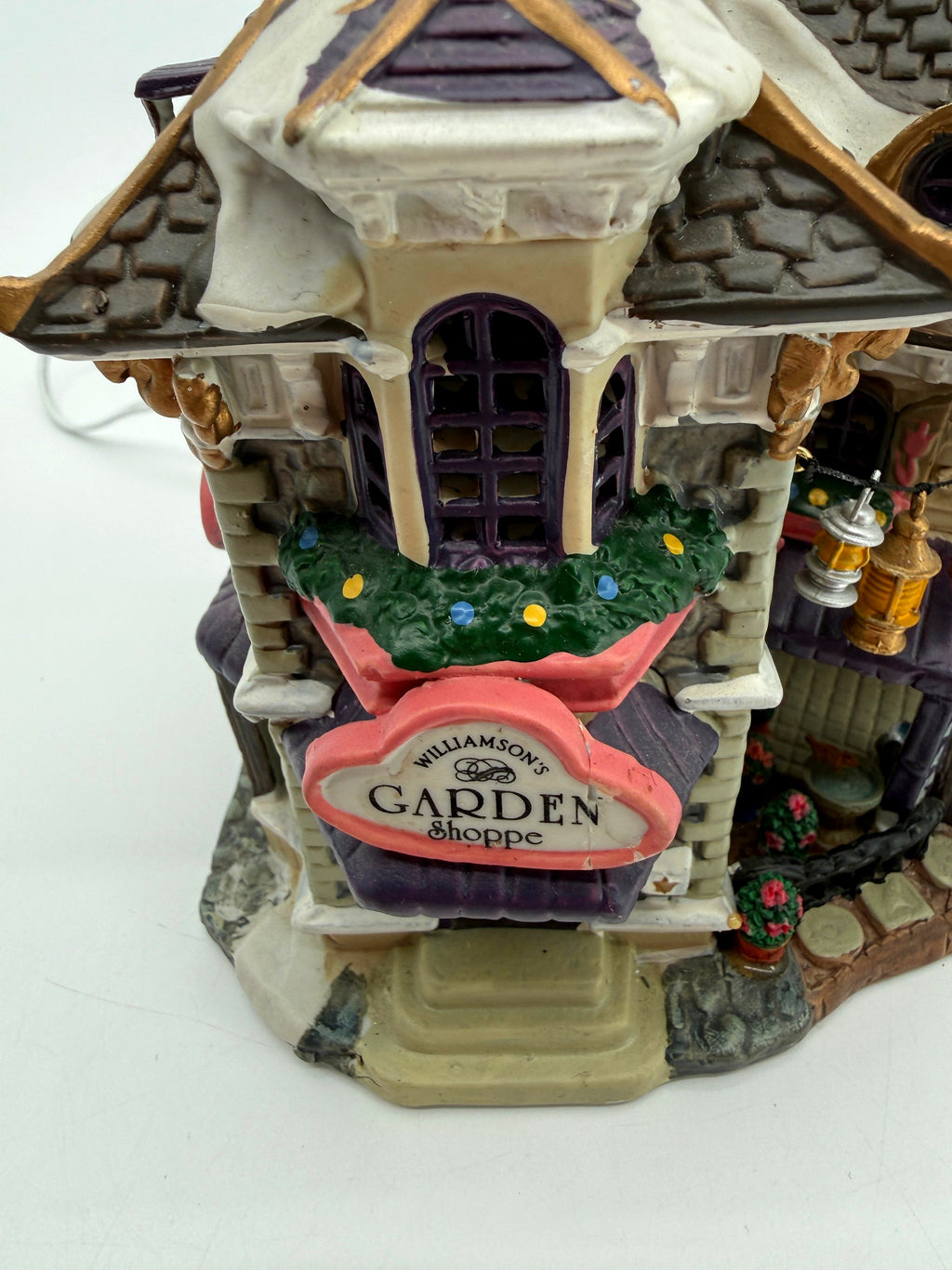 Close-up of the Williamson's Garden Shoppe sign and garland window box (enhanced photo)