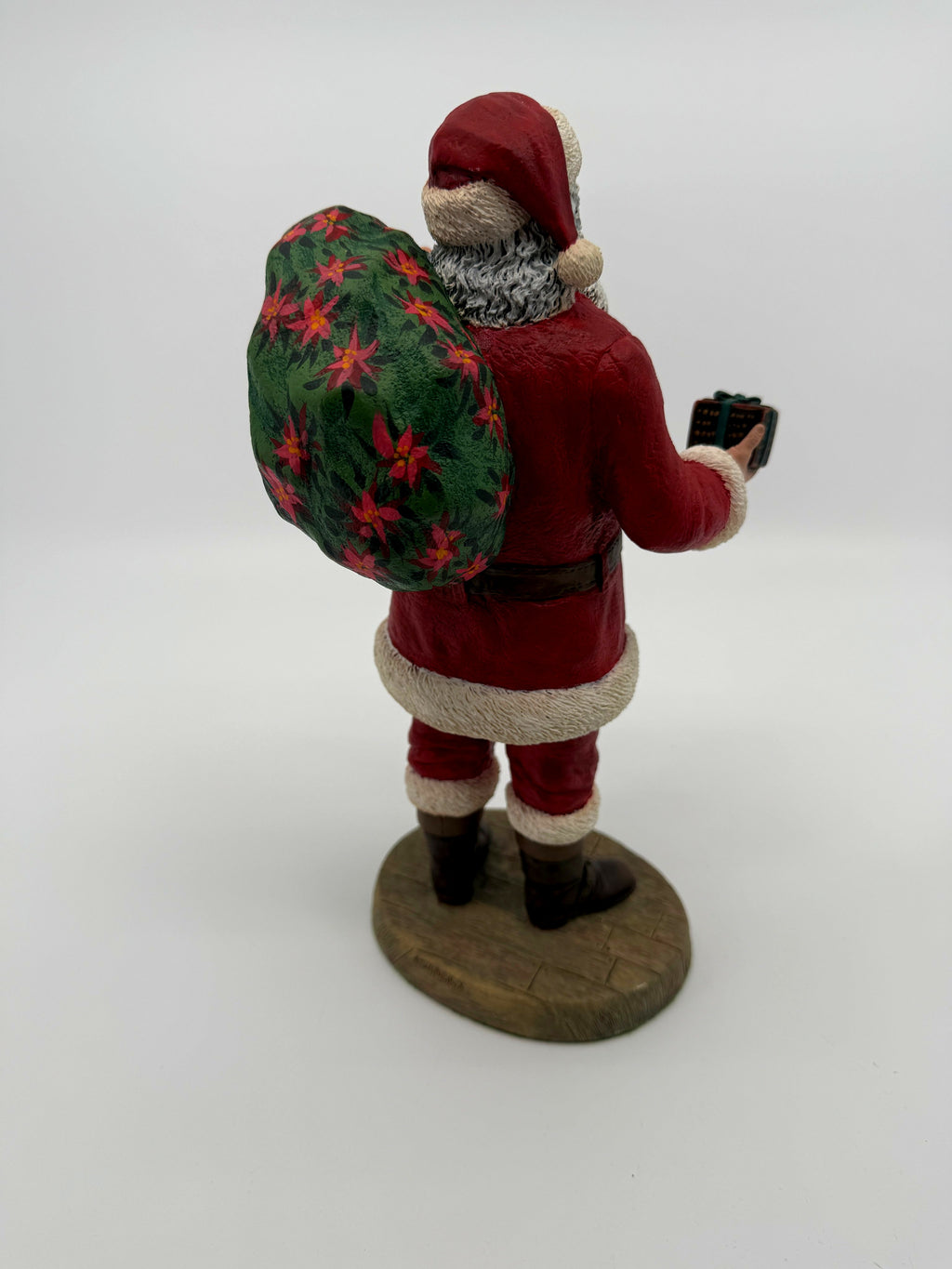 Vintage 1994 Duncan Royale Santa's Gift figurine – back view from the other side