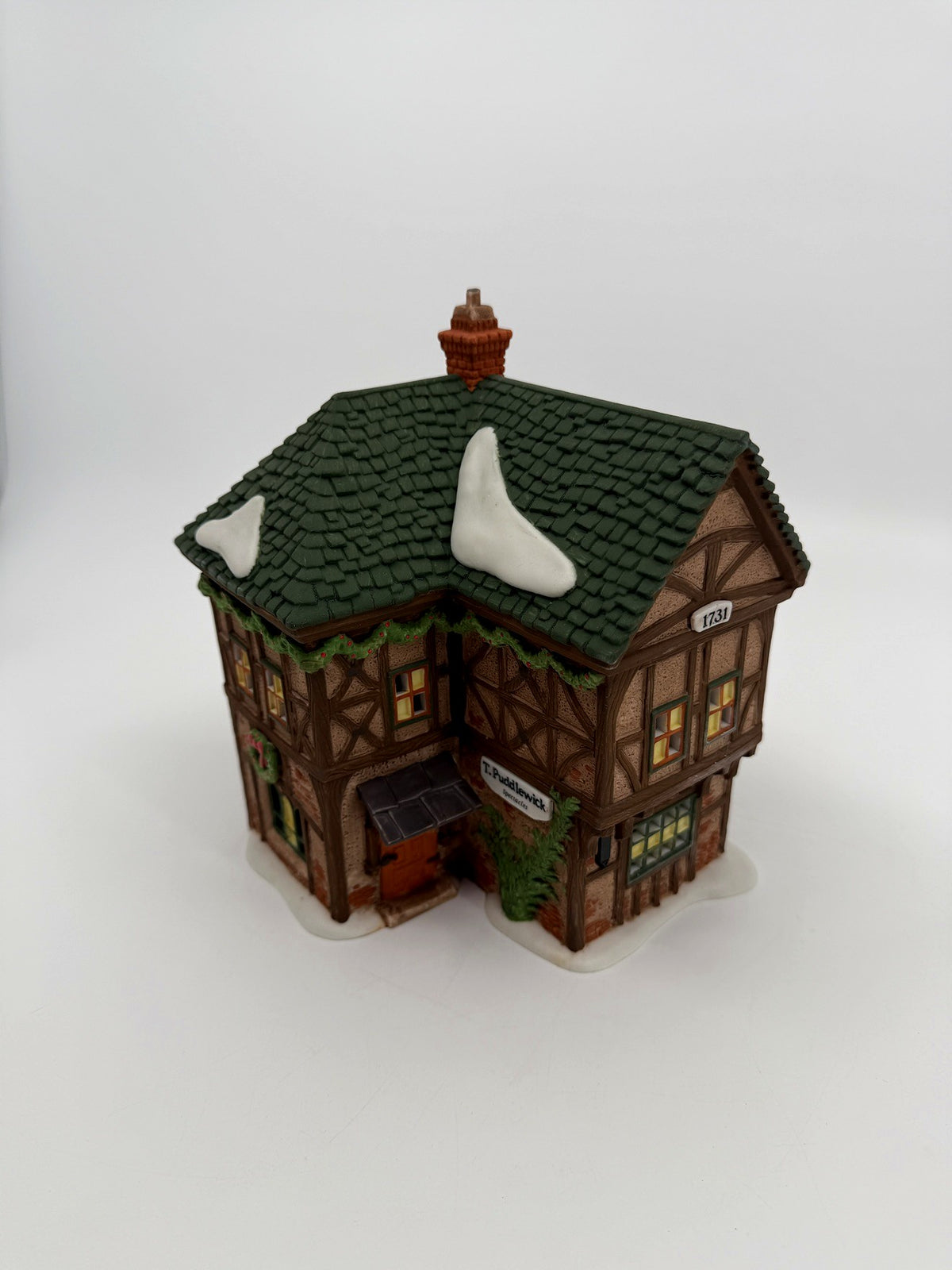 Department 56 Dickens' Village T. Puddlewick Spectacle Shop #58334 — three-quarter view of the side and front