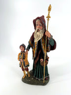 Three-quarter view — ornate gold-tone staff head and the cloak's painted golden border