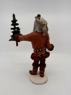 Vintage 1983 Duncan Royale Pioneer Santa figurine – three-quarter front view with collector's booklet