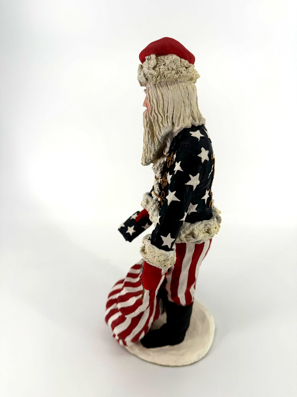 Duncan Royale Civil War Santa - left side profile showing the star-covered coat sleeve, fur cuff and striped trousers