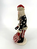 Duncan Royale Civil War Santa - left side profile showing the star-covered coat sleeve, fur cuff and striped trousers