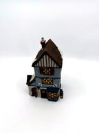 Department 56 Dickens' Village Poulterer 1988 lighted porcelain poultry shop — front three-quarter view, closer