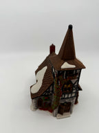 Department 56 Dickens' Village Old Michaelchurch 1992 lighted porcelain church — high-angle front view showing snow-dusted shingle roofs