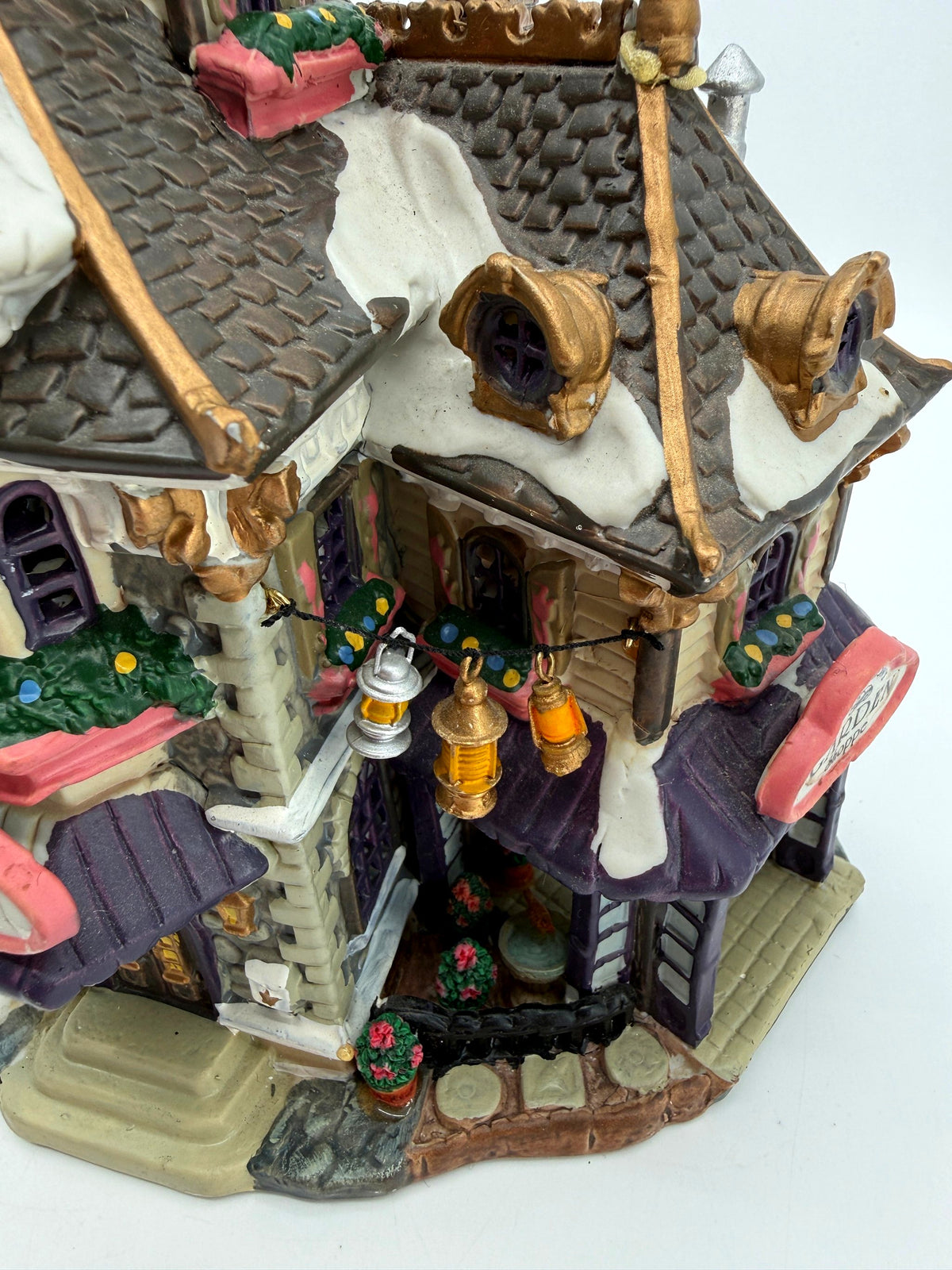 Top detail: dormers, hanging lanterns and the garden courtyard (enhanced photo)