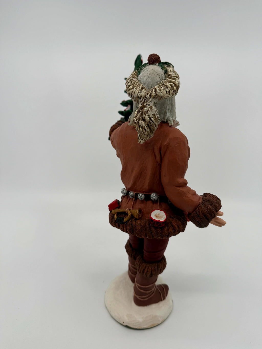 Vintage 1983 Duncan Royale Pioneer Santa figurine – side view with collector's booklet hanging from the tree