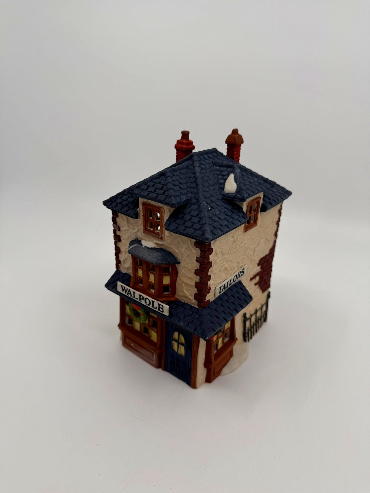 Department 56 Dickens' Village Walpole Tailors #5926-9 — front three-quarter view from above showing both WALPOLE and TAILORS signs