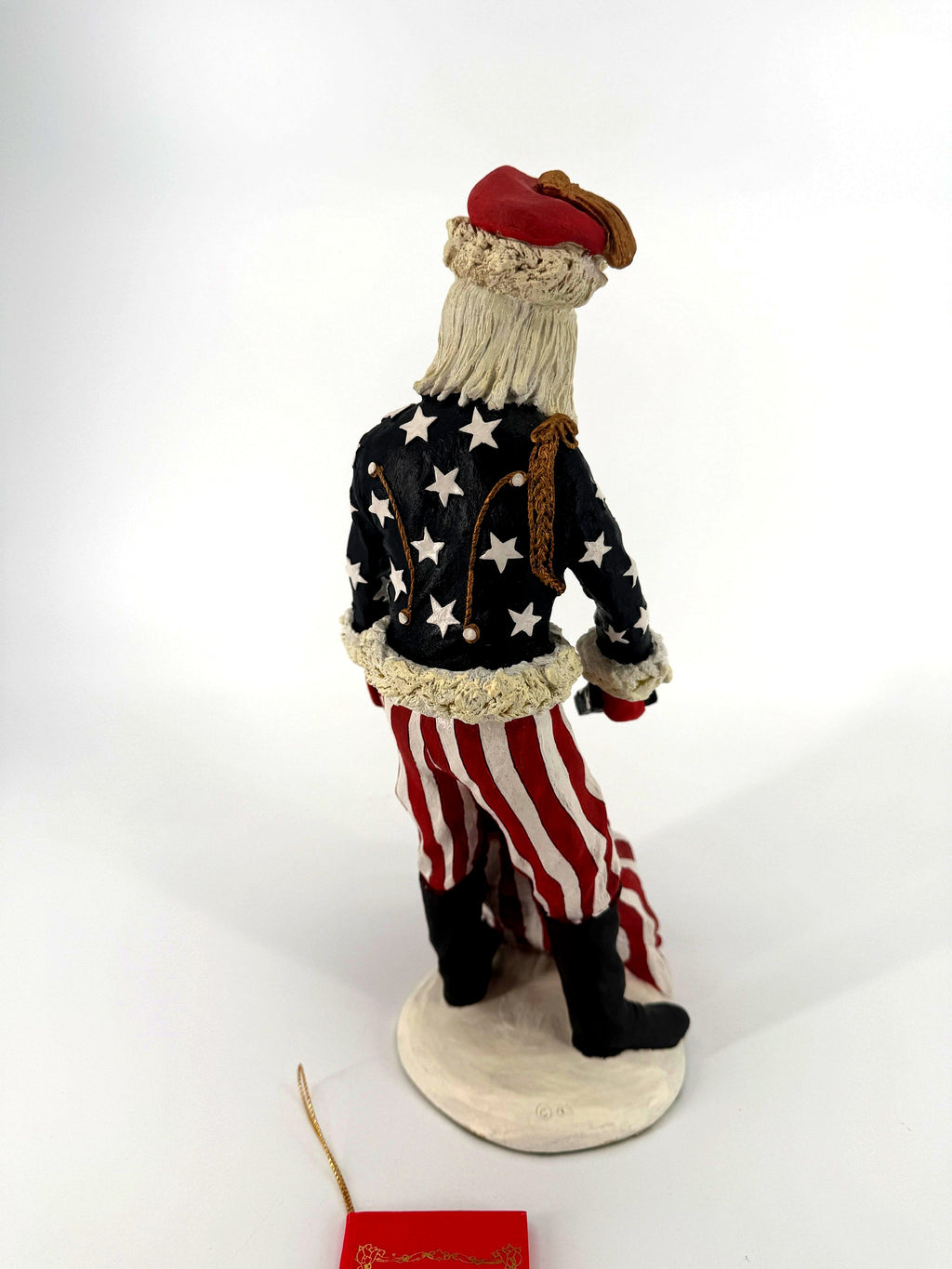 Duncan Royale Civil War Santa - back view showing the star-covered coat back with gold cord trim, striped trousers and tall black boots