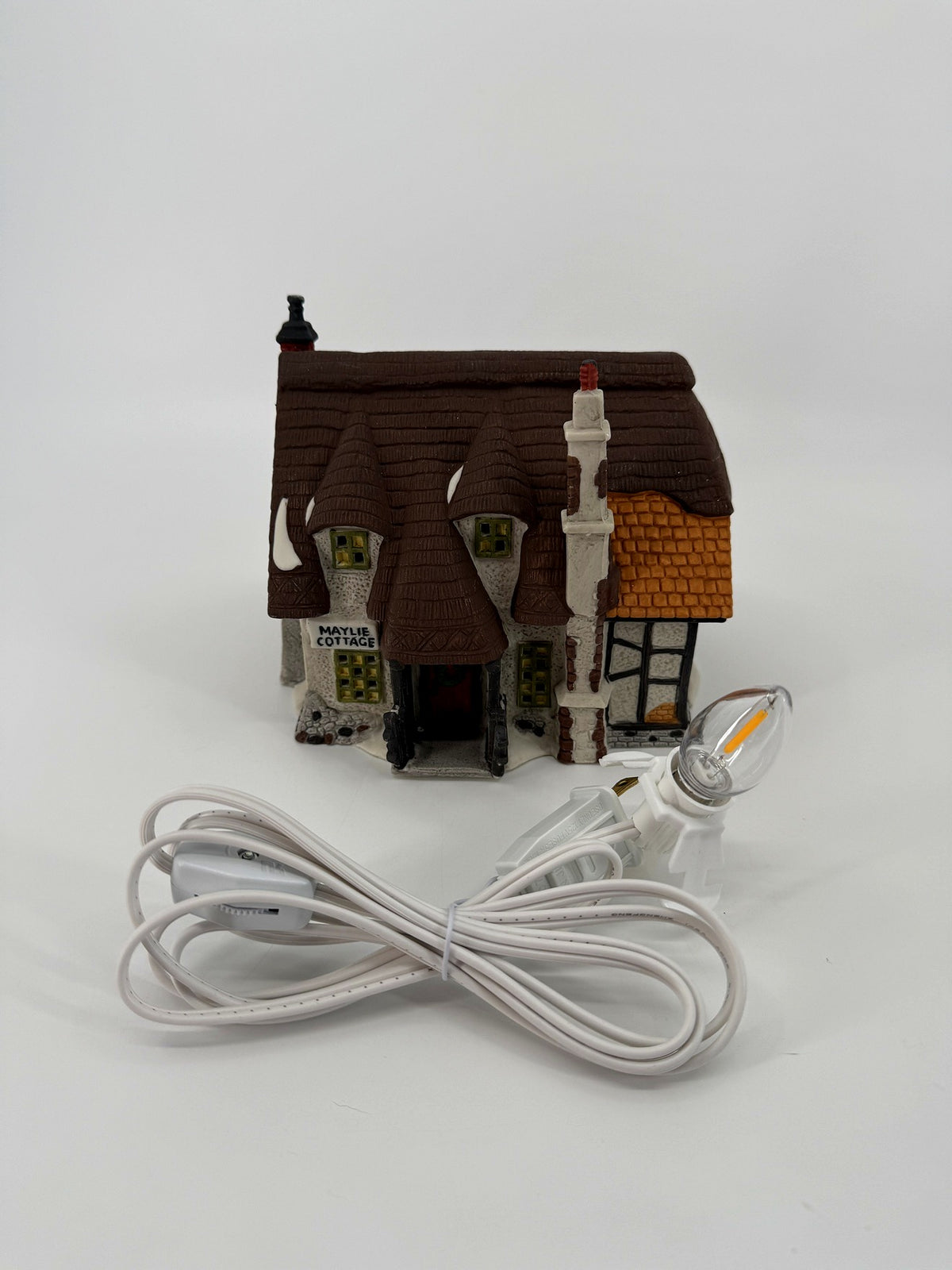 Department 56 Dickens' Village Maylie Cottage #5553-0, Oliver Twist — front view with the new replacement light cord and bulb