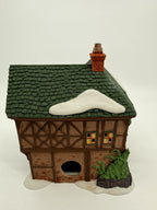 Department 56 Dickens' Village T. Puddlewick Spectacle Shop #58334 — back view showing the light cord opening