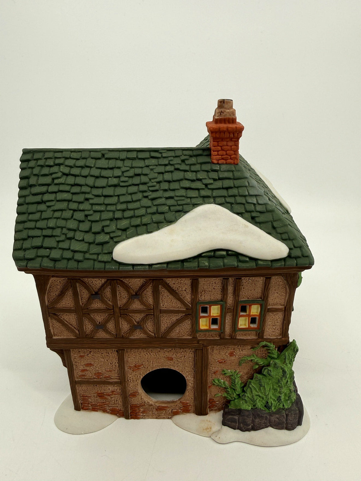 Department 56 Dickens' Village T. Puddlewick Spectacle Shop #58334 — back view showing the light cord opening