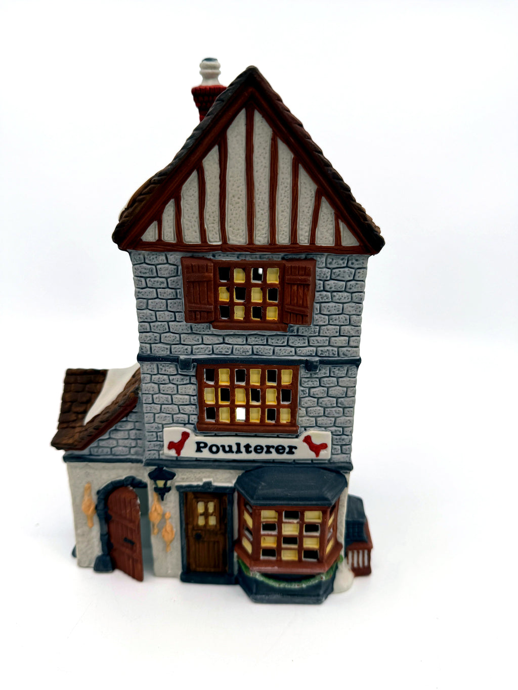 Department 56 Dickens' Village Poulterer 1988 lighted porcelain poultry shop — front close view: sign, bay window and hanging poultry