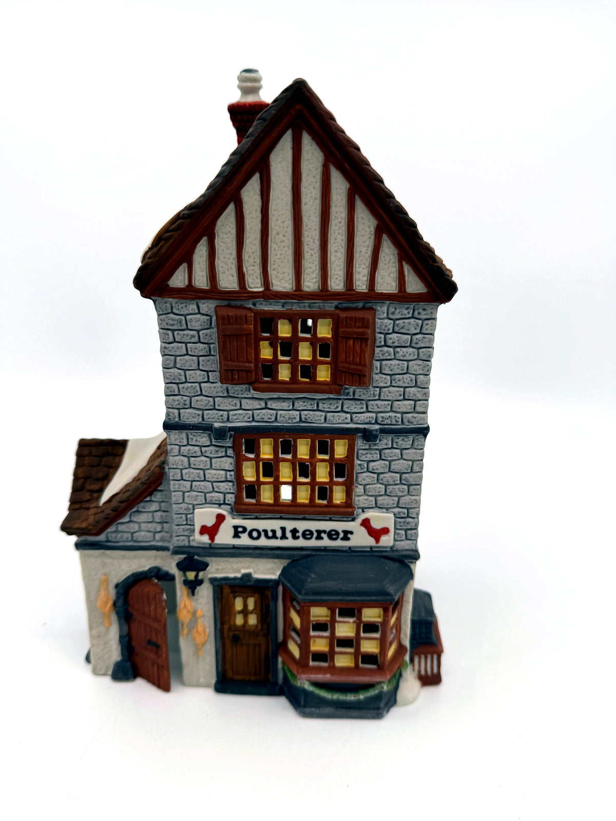 Department 56 Dickens' Village Poulterer 1988 lighted porcelain poultry shop — front close view: sign, bay window and hanging poultry