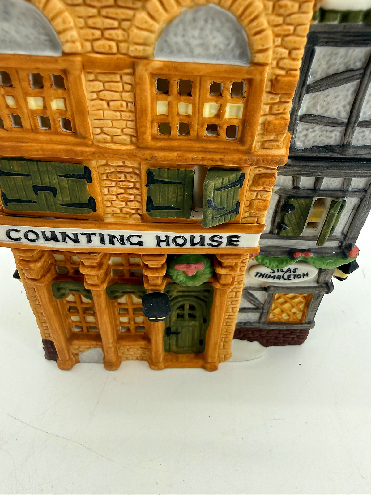Front close-up showing the Counting House sign, wreath and Silas Thimbleton barrister sign