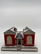 Front view close showing the columned entrance portico and arched windows