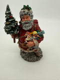 Vintage 1991 Duncan Royale Today's Nast Santa figurine – front view: red-suited Santa with snow-flocked beard carrying a flocked Christmas tree and an armful of toys; Collectors Club Exclusive No. 0011 of 15,000
