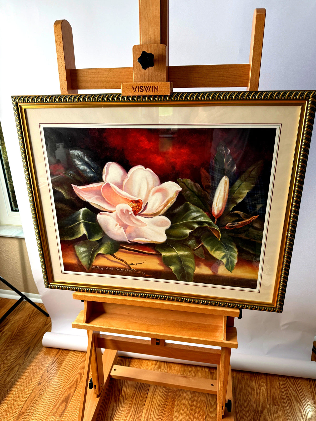 Peggy Thatch Sibley magnolia floral print, framed and matted — on an easel, straight front view