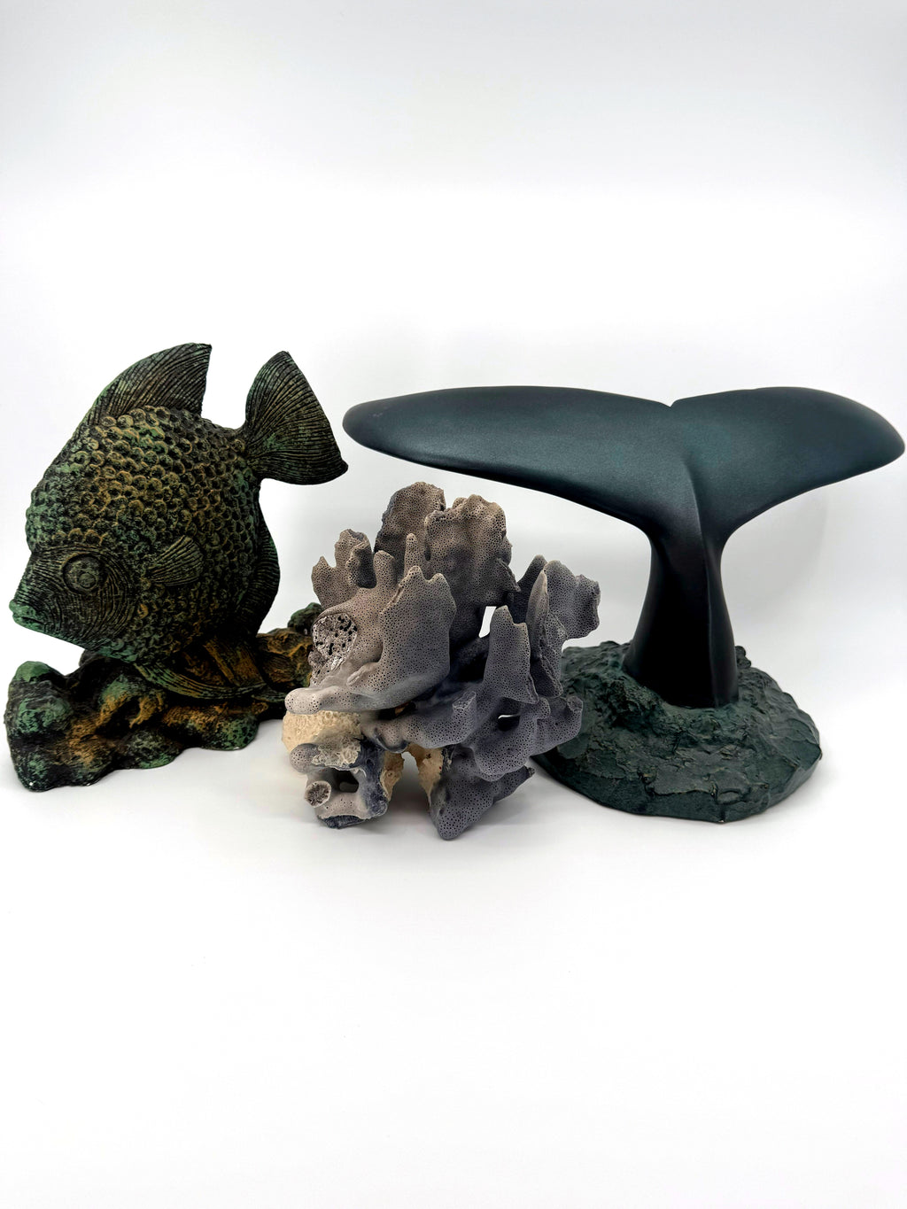 Blue coral specimen on natural base, coastal decor — styled between a fish figurine and a whale tail sculpture for scale — props not included