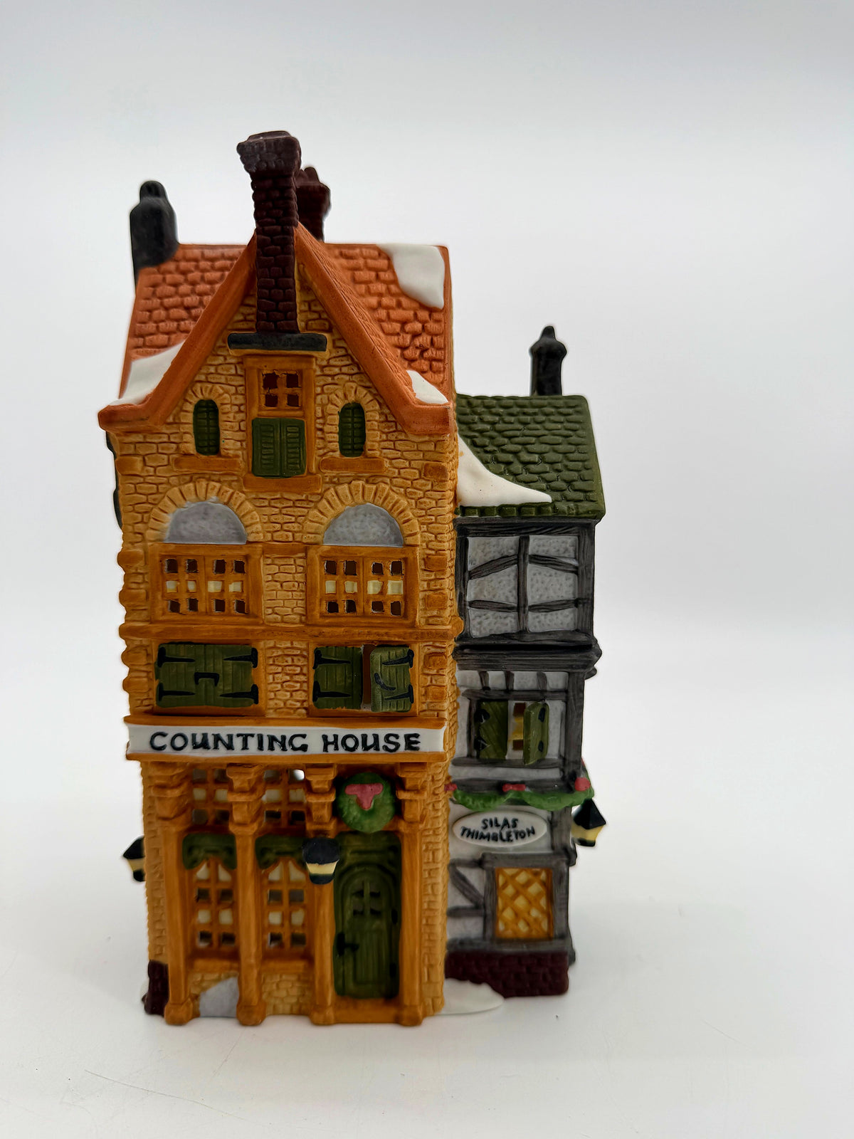 Front view from above showing the snow-dusted roofs of both wings