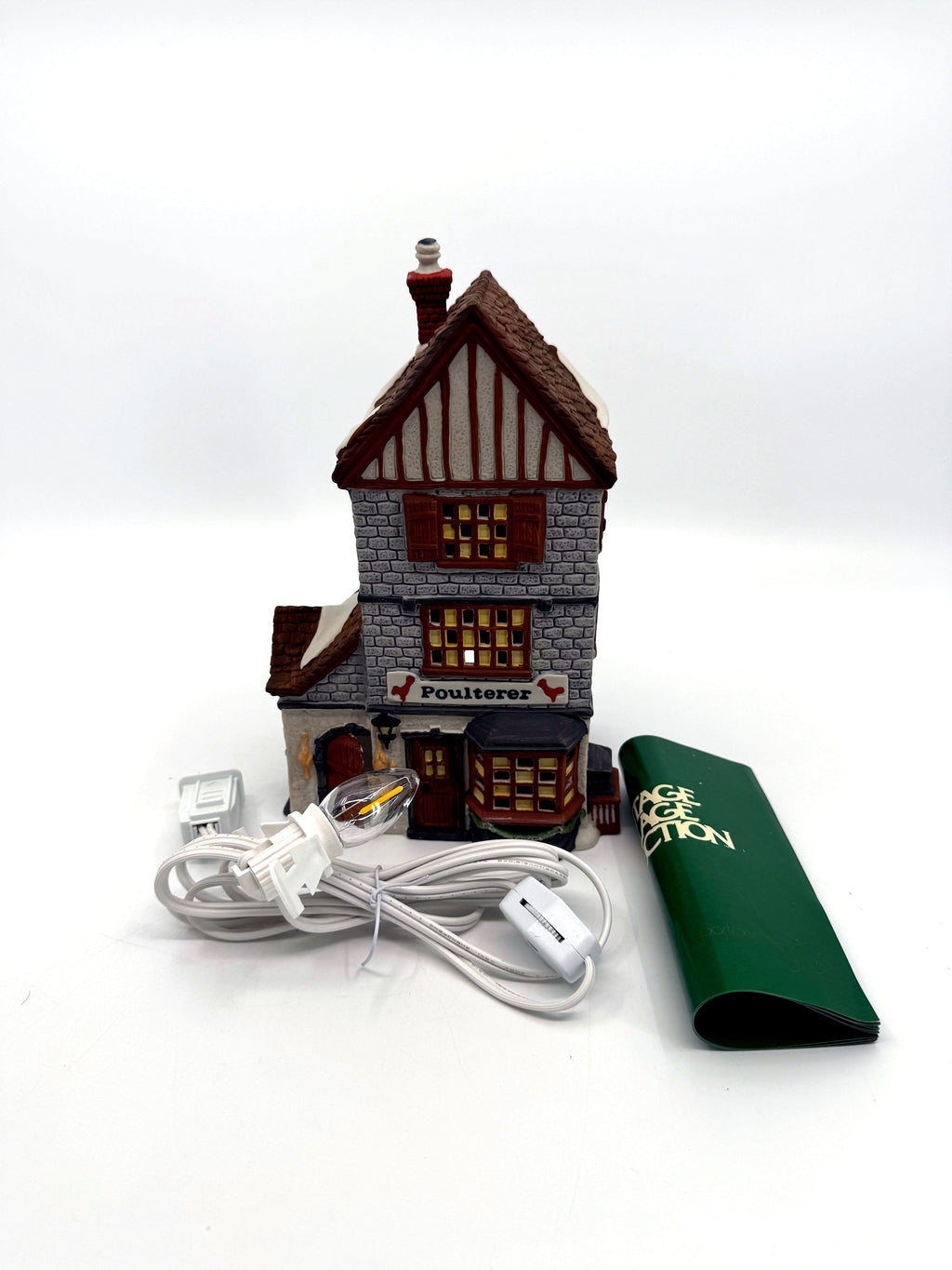Department 56 Dickens' Village Poulterer 1988 lighted porcelain poultry shop — front view with new replacement light cord, bulb and original booklet