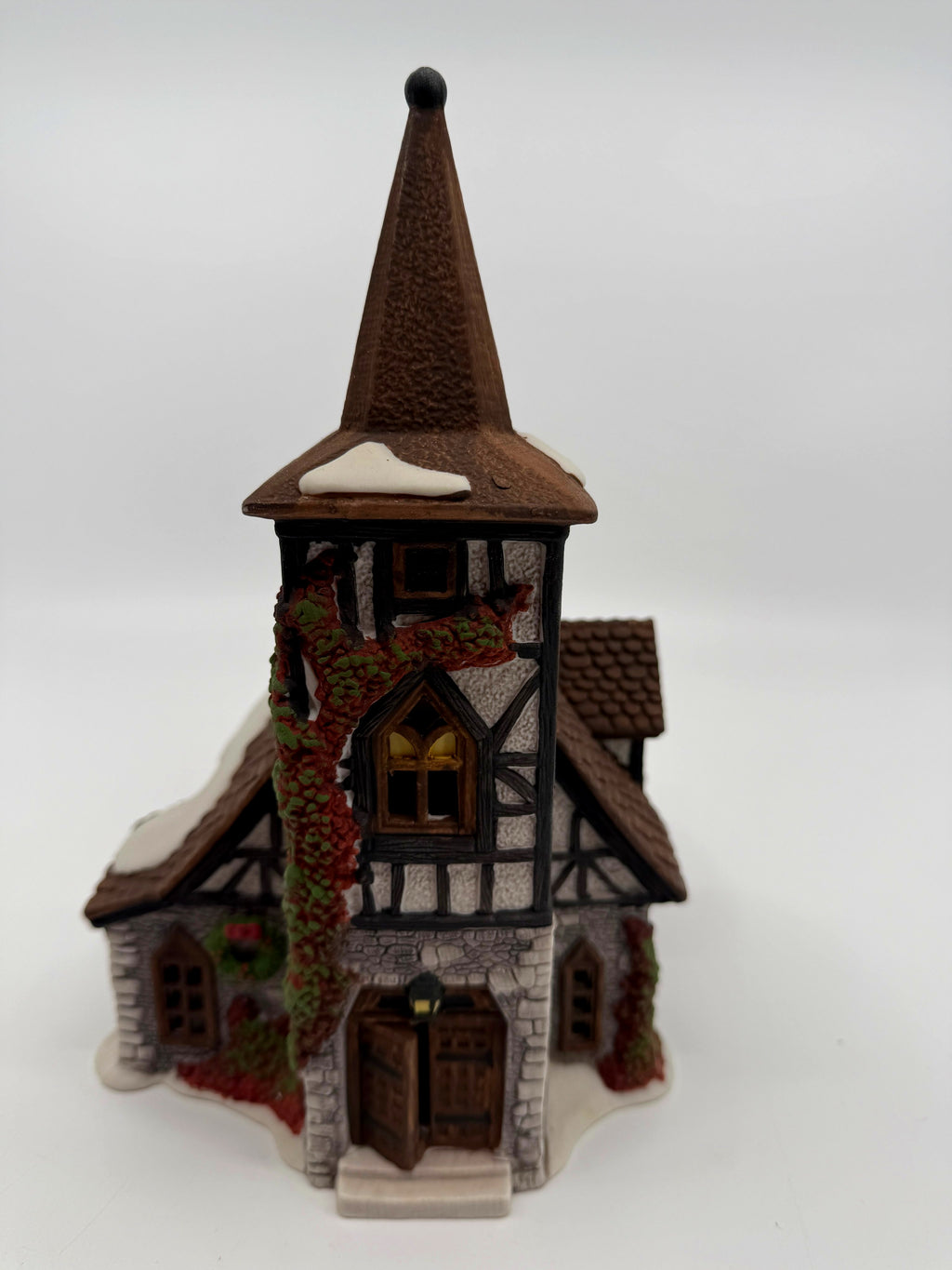 Department 56 Dickens' Village Old Michaelchurch 1992 lighted porcelain church — front view: stone-and-timber church with tall spire tower