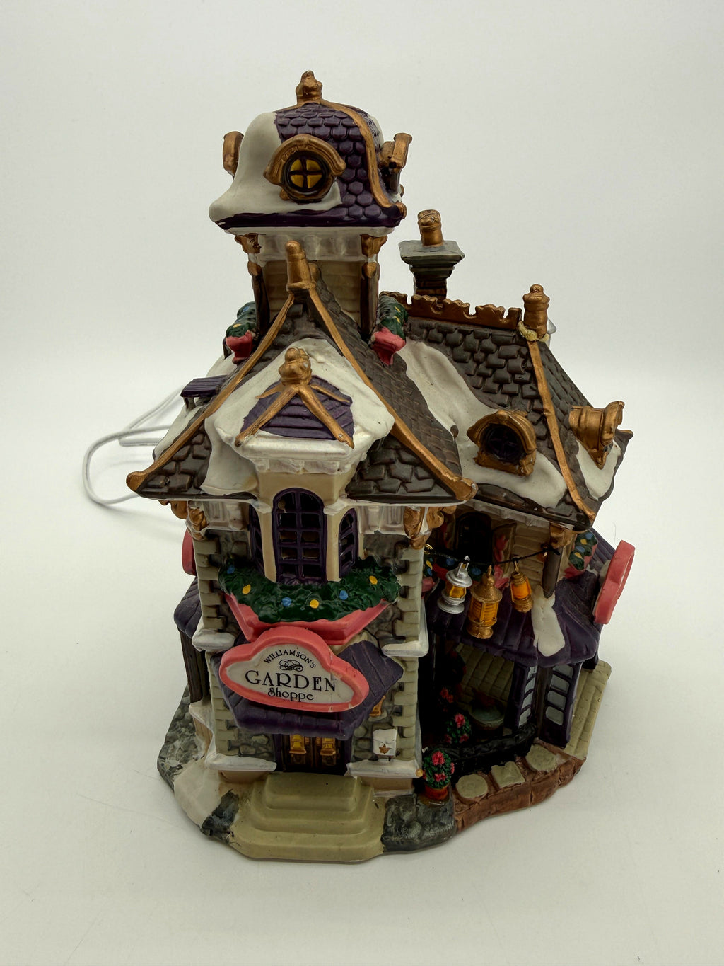 Tower and roofline quarter view with gold trim and snow (enhanced photo)