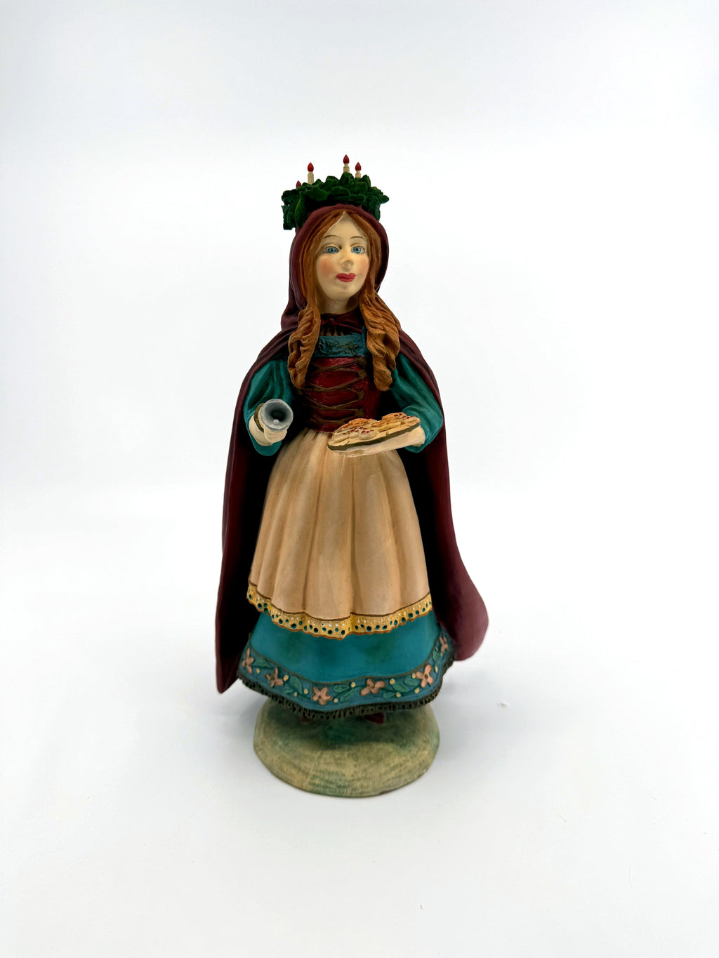 St. Lucia figurine — full front view on its round base