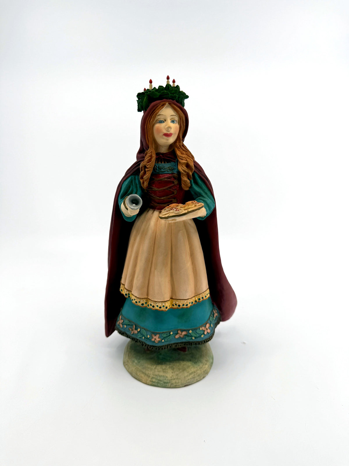 St. Lucia figurine — full front view on its round base