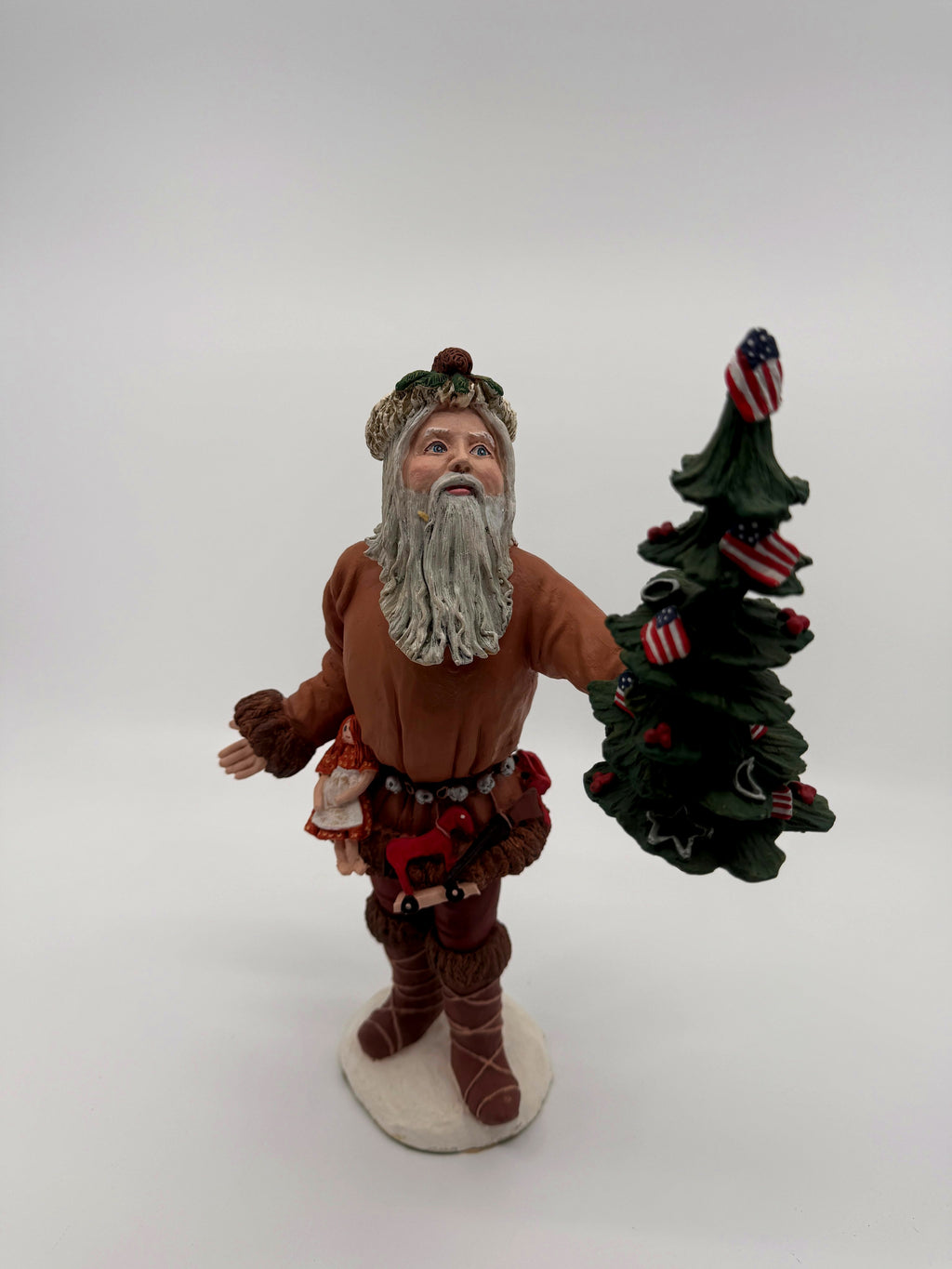 Vintage 1983 Duncan Royale Pioneer Santa figurine – back view showing the jingle-bell belt, tiny drum and brass horn